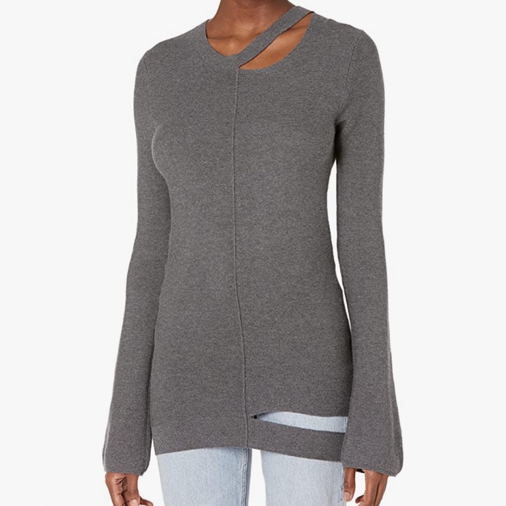 Cable stitch distressed cut out sweater.